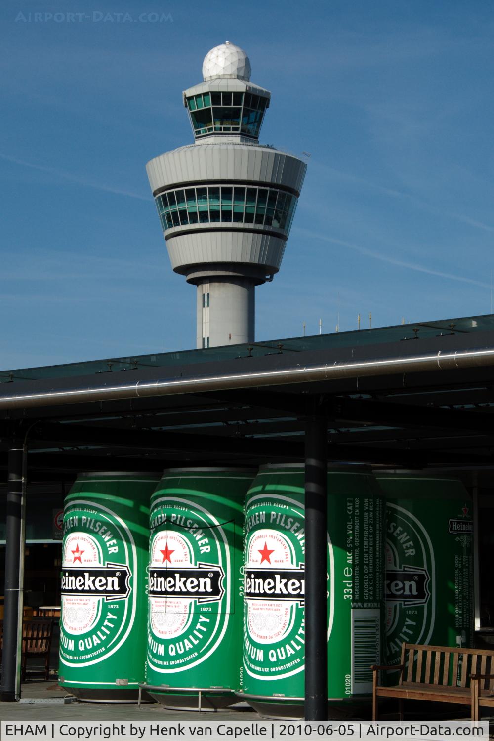 Amsterdam Schiphol Airport, Haarlemmermeer, near Amsterdam Netherlands (EHAM) - Schiphol control tower and an add for an average Dutch beer as seen from the observation platform.