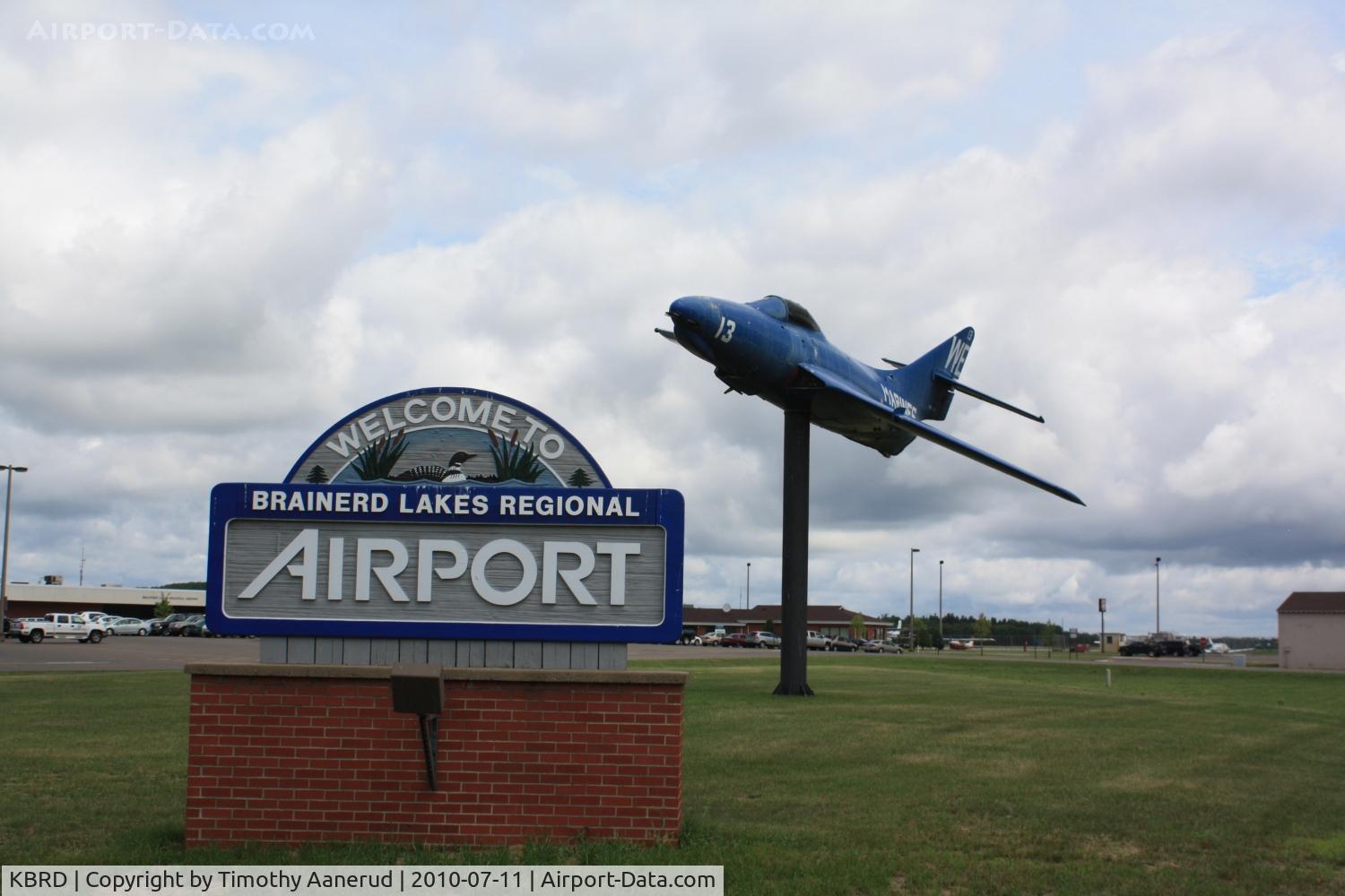 Brainerd Lakes Regional Airport (BRD) - Entrance sign and plane on pole
