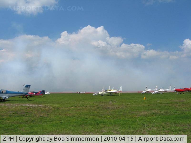 Zephyrhills Municipal Airport (ZPH) - Transient activity and someone laying down a little smoke during Sun N Fun week