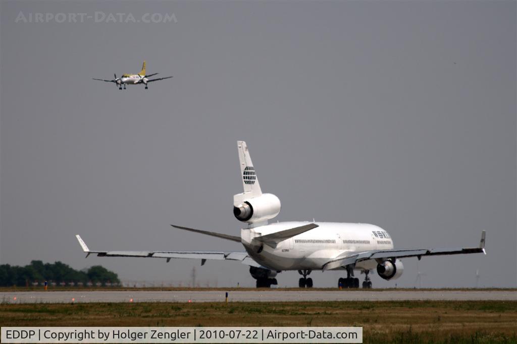 Leipzig/Halle Airport, Leipzig/Halle Germany (EDDP) - The giant and the flea at rwy 26R.