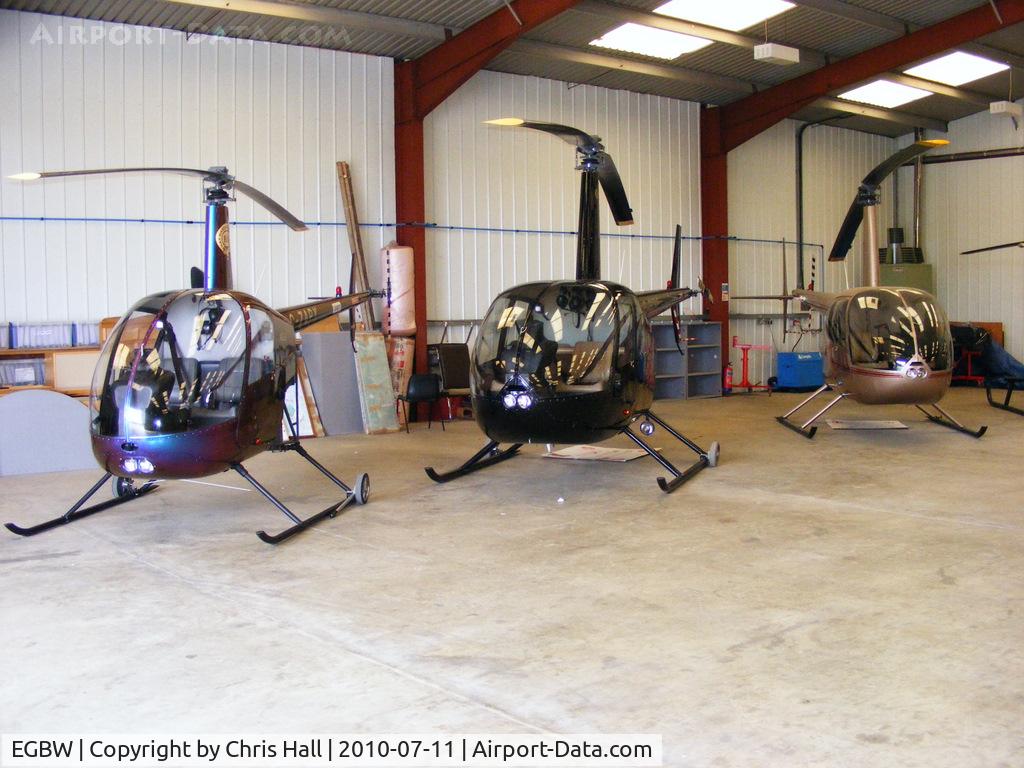 Wellesbourne Mountford Airfield Airport, Wellesbourne, England United Kingdom (EGBW) - Robinson R22 and R44 helicopters in the Heli Air hangar at Wellesbourne Mountford