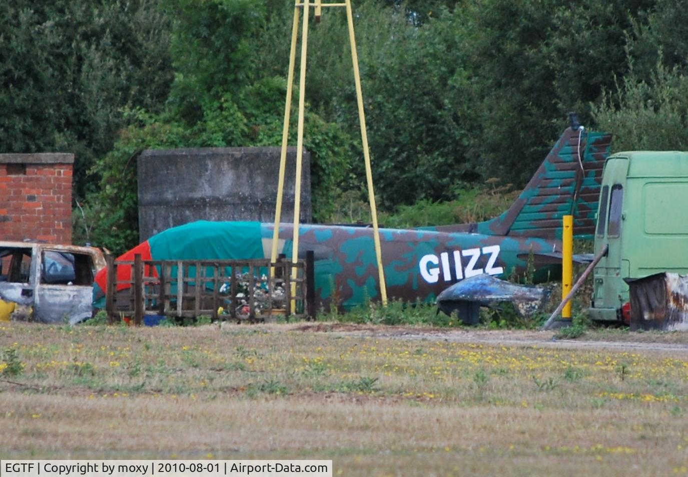 Fairoaks Airport, Chobham, England United Kingdom (EGTF) - Fairoaks fire practice area. The aircraft has a rather 'becoming' registration. 
