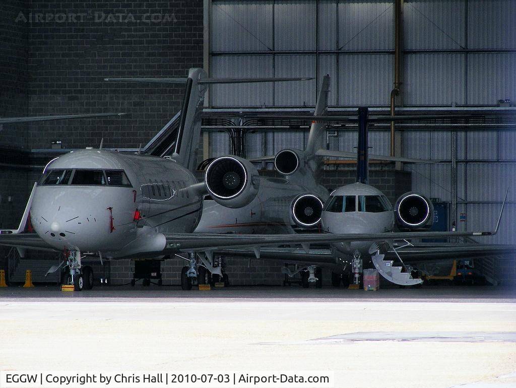 London Luton Airport, London, England United Kingdom (EGGW) - Biz jets inside the Signature Flight Support hangar