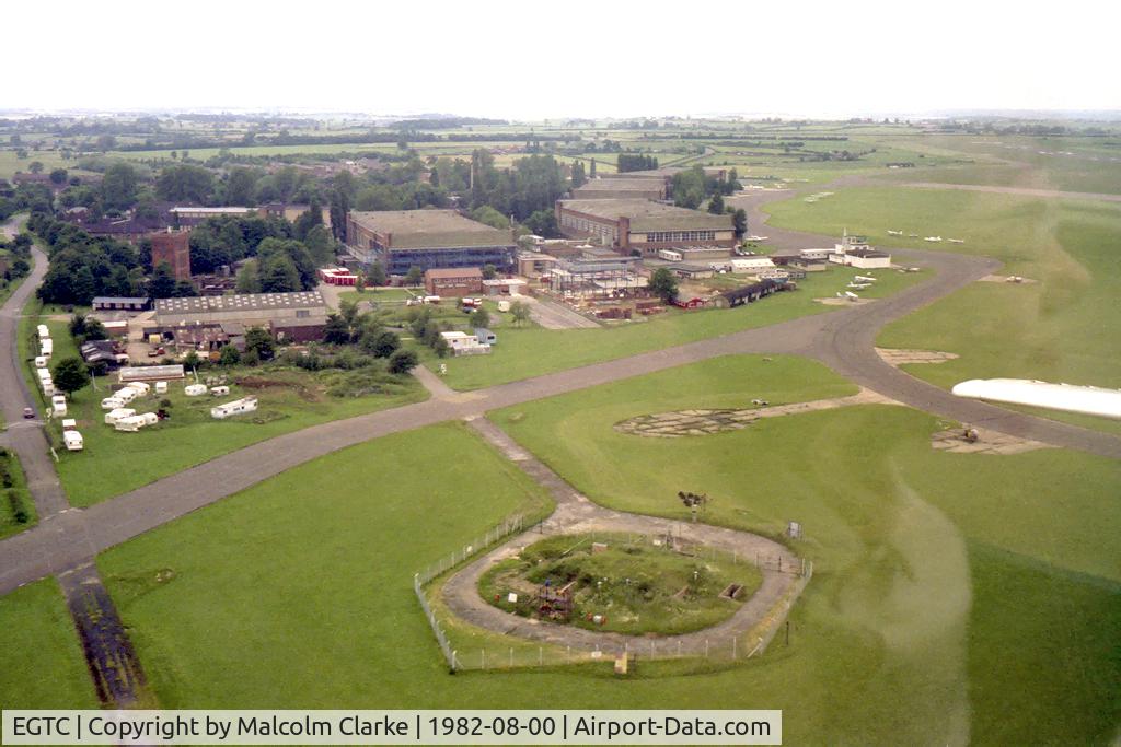 Cranfield Airport, Cranfield, England United Kingdom (EGTC) - Cranfield Airfield in August 1982. Contains an 'eerie' reflection of my daughter!
