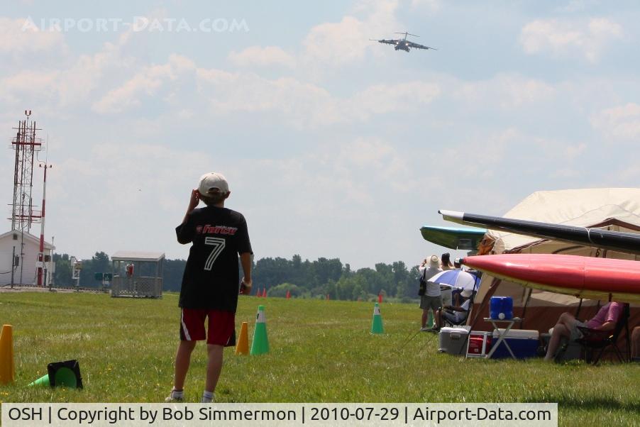 Wittman Regional Airport (OSH) - A little fellow watching a C-17A (01-0192) arrive at Airventure 2010 - Oshkosh, Wisconsin
