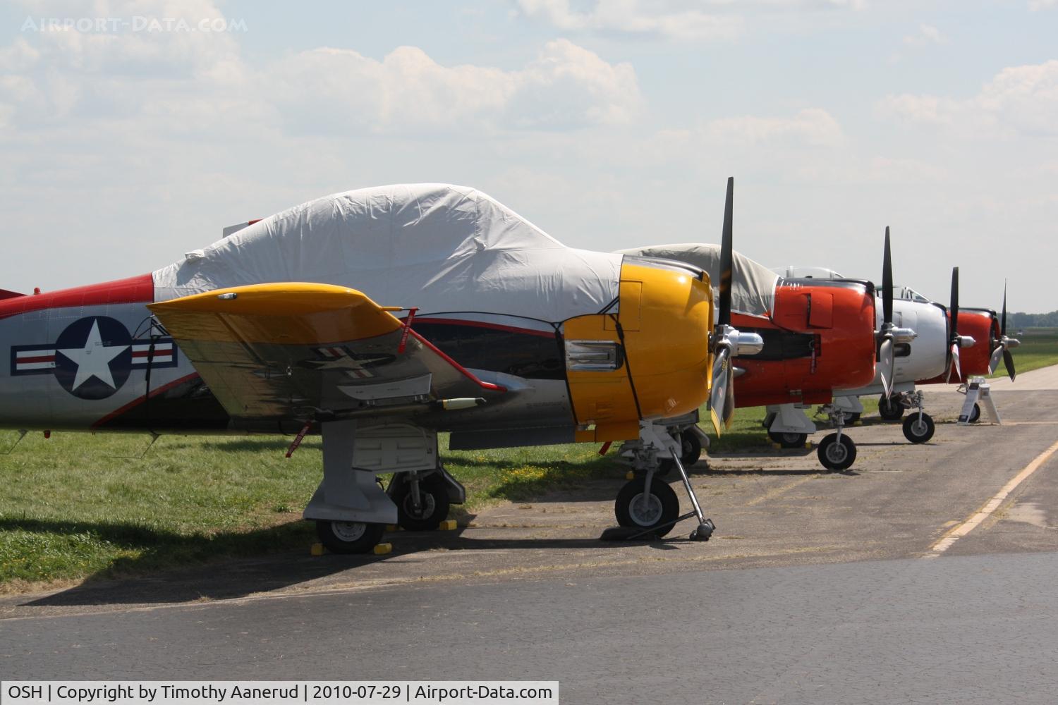 Wittman Regional Airport (OSH) - T-28's on the flightline.  First T-28 might be N81643