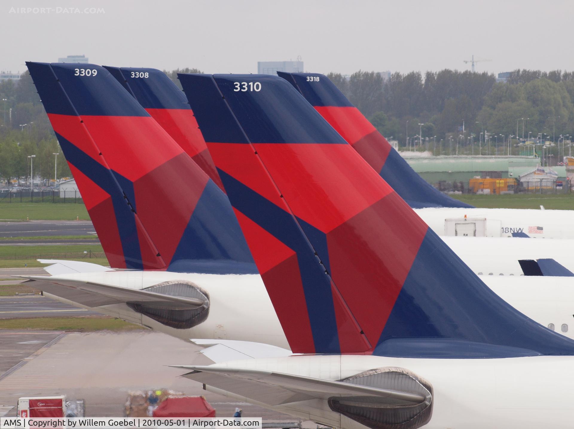 Amsterdam Schiphol Airport, Haarlemmermeer, near Amsterdam Netherlands (AMS) - A part of the old North West Airline fleet in the new Delta Colours.