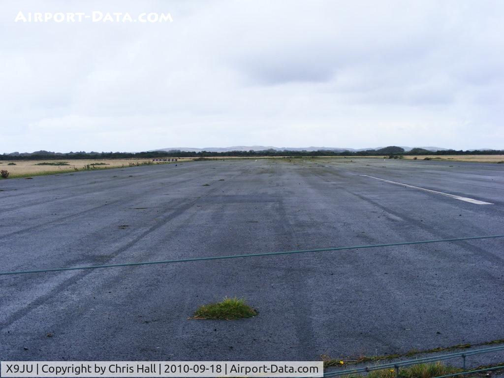 X9JU Airport - a section of R/W 25/07 at Jurby Airfield, IOM. which is bisected by a road