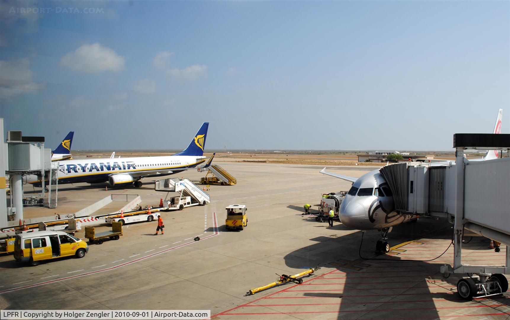 Faro Airport, Faro Portugal (LPFR) - View to papos of tourist carriers at FAO.