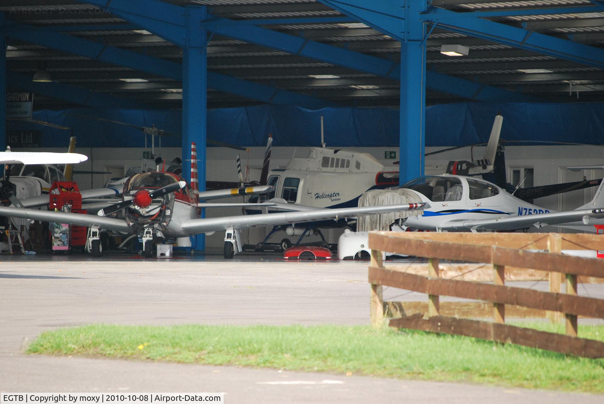 Wycombe Air Park/Booker Airport, High Wycombe, England United Kingdom (EGTB) - Busy hangar at Wycombe Air Park