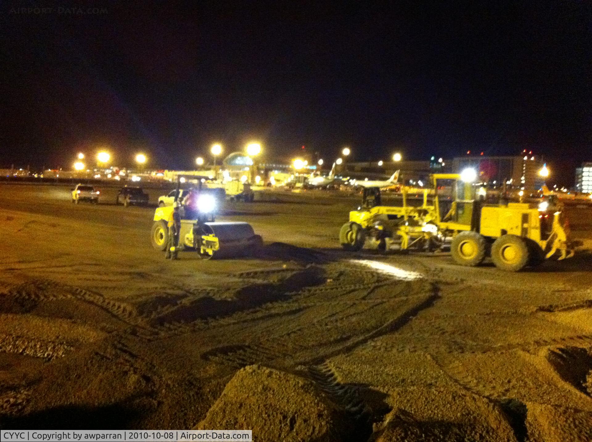Calgary International Airport, Calgary, Alberta Canada (CYYC) - This is the present on-going construction at Calgary International  This is a night time shot near the south east end where the new concourse is going.