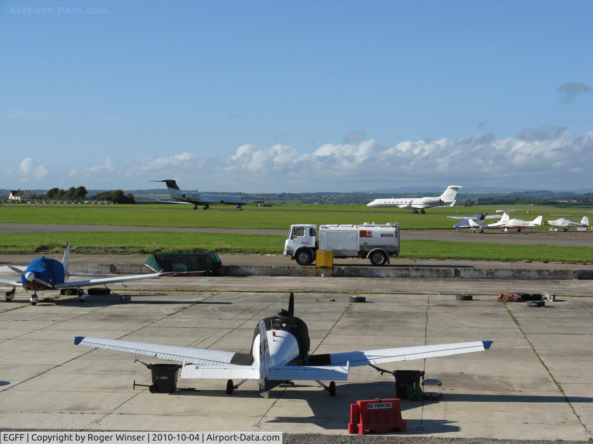 Cardiff International Airport, Cardiff, Wales United Kingdom (EGFF) - View over the GA apron to two 