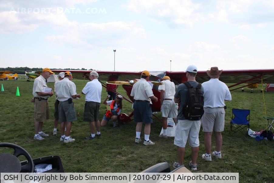 Wittman Regional Airport (OSH) - Judging crew checking out N33708 at Airventure 2010.