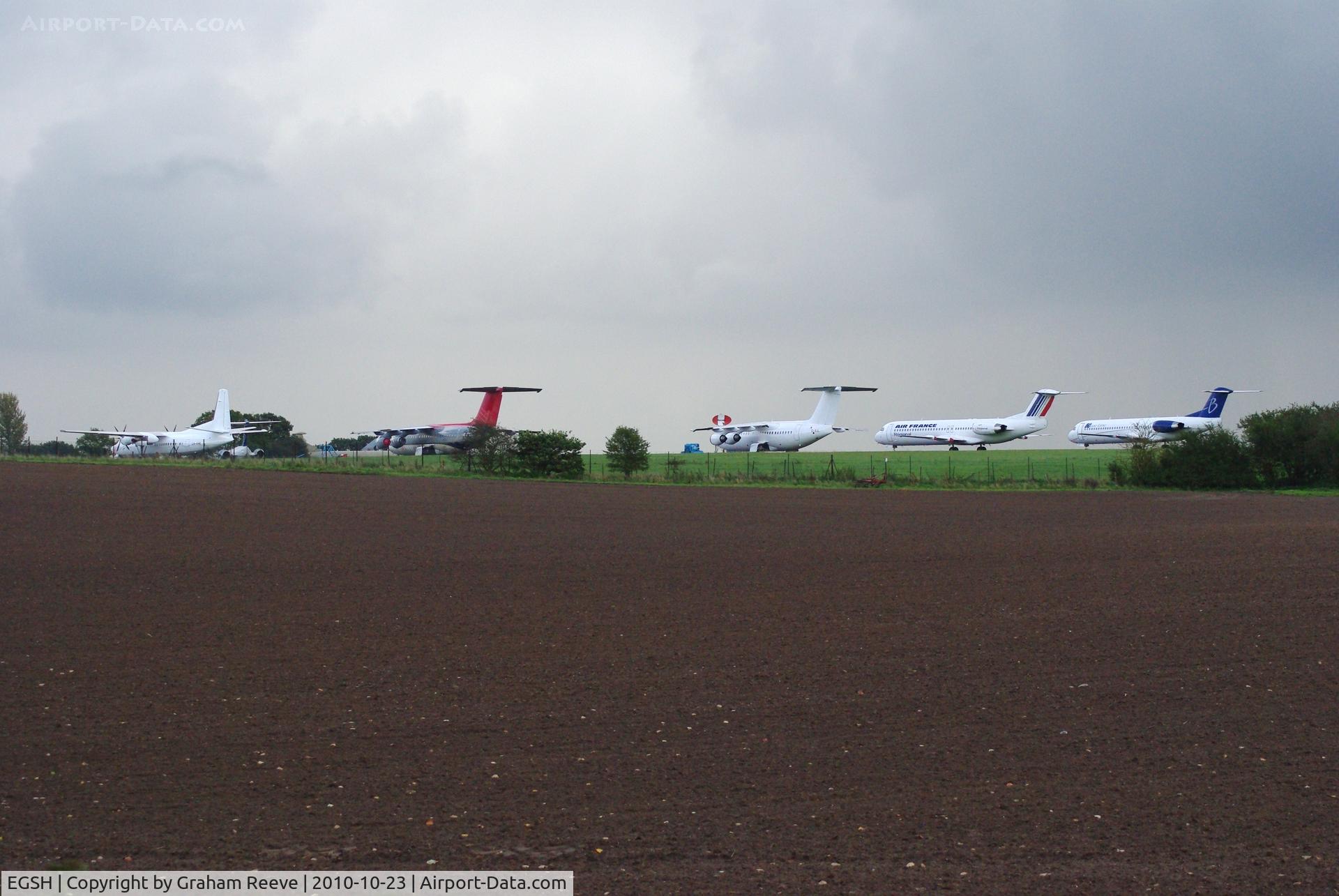 Norwich International Airport, Norwich, England United Kingdom (EGSH) - An impressive line up of a Fokker 50, two BAe 146's, Two Fokker 100's with a third just visible. 