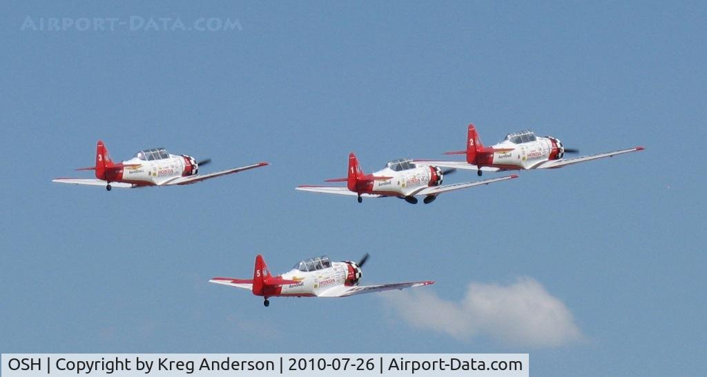Wittman Regional Airport (OSH) - Aeroshell Aerobatic Team departing for the National Anthem.