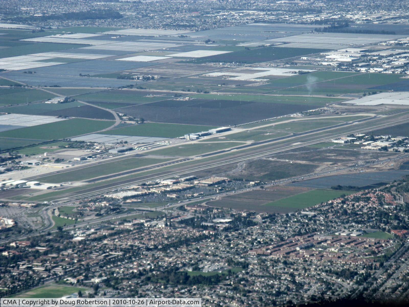 Camarillo Airport (CMA) - Rwy 08-26 taken from RV-7 over city of Camarillo northeast of field looking southwest. Note greatly displaced threshold-Rwy 26. Oxnard eastern city limits at top of photo. Extensive farmland between the cities.
