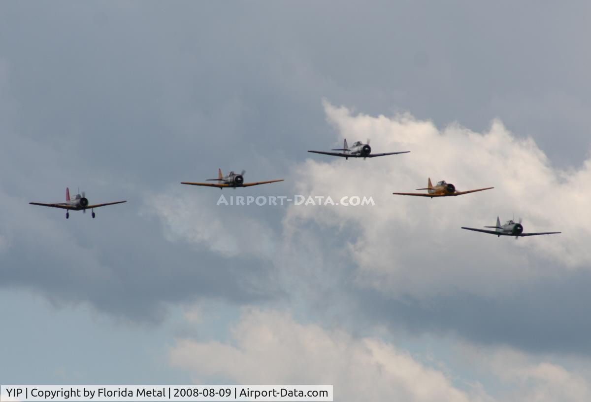 Willow Run Airport (YIP) - T-6s in formation with a single BT-13