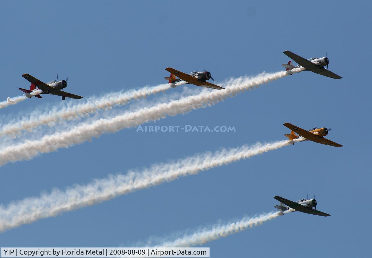Willow Run Airport (YIP) - T-6s in formation with a single BT-13