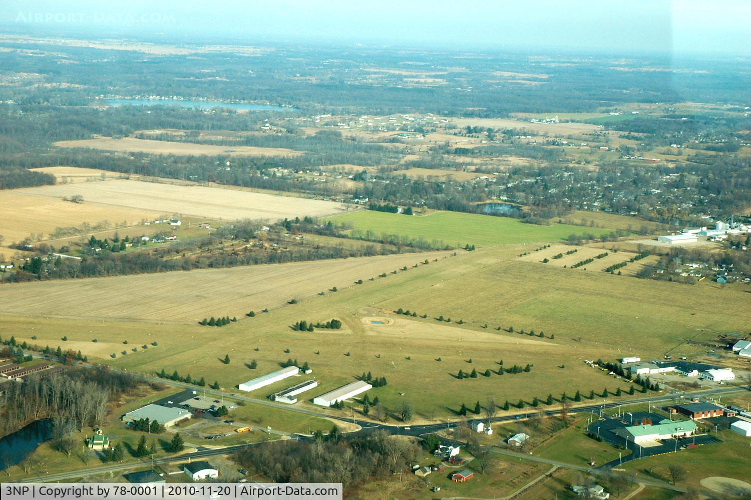 Napoleon Airport (3NP) - My daughter took this photo from the backseat of our 172 as we were departing on the downwind leg back to TTF (Monroe Custer). Napoleon is a beautiful airport.... Wide long smooth runways, Great lunch at the Napoleon Cafe, a short walk from the parking ar
