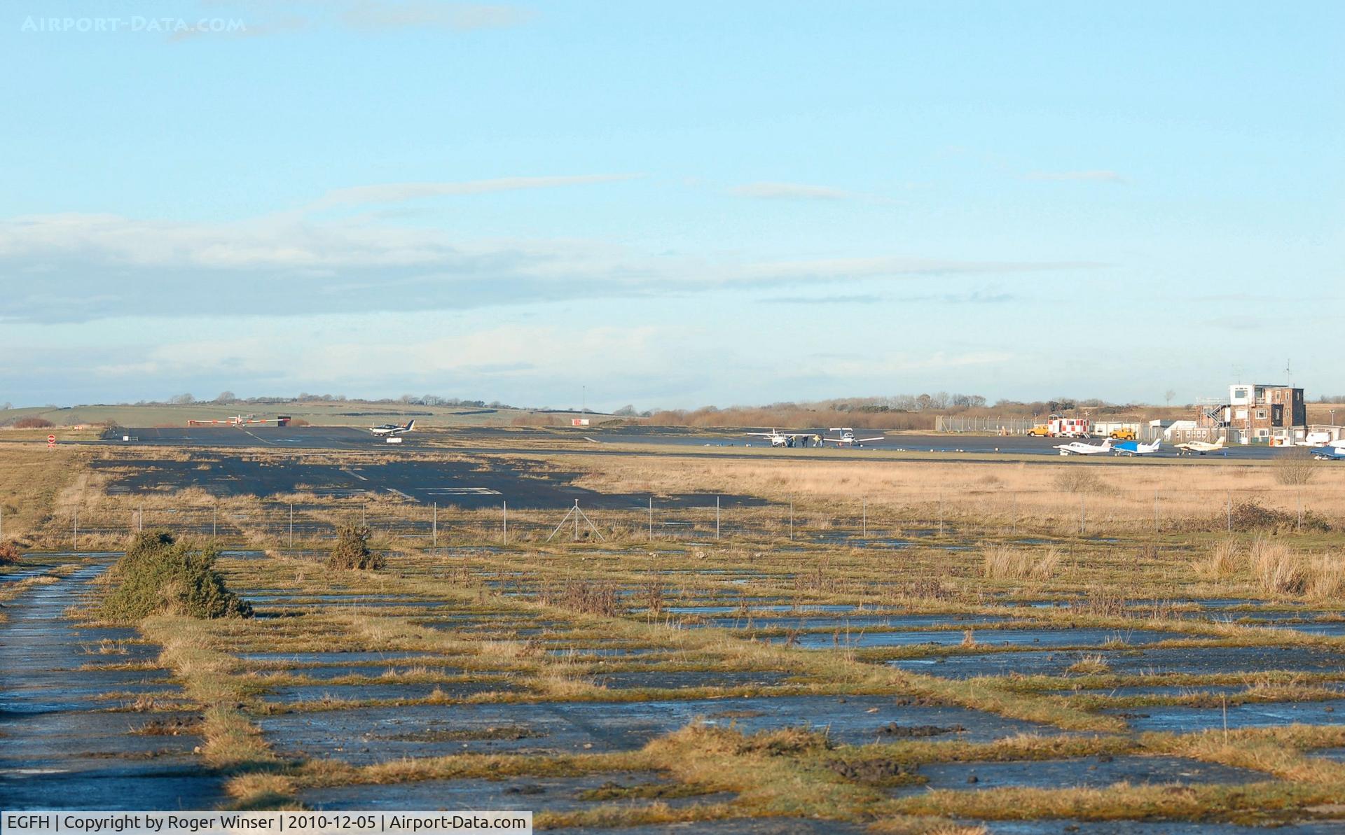 Swansea Airport, Swansea, Wales United Kingdom (EGFH) - Looking north west along the out of use Runway 15/33.
