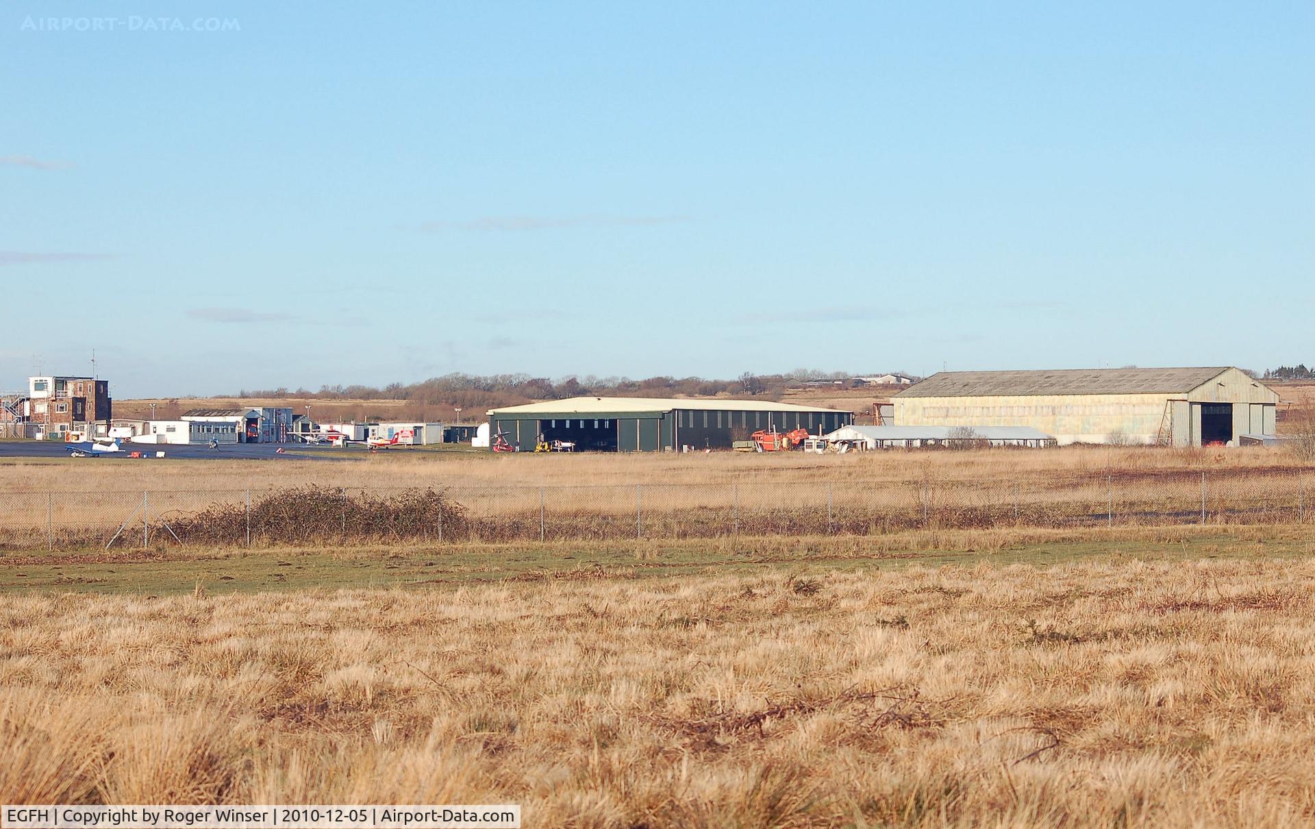 Swansea Airport, Swansea, Wales United Kingdom (EGFH) - General view towards the airport buildings and the two hangars.