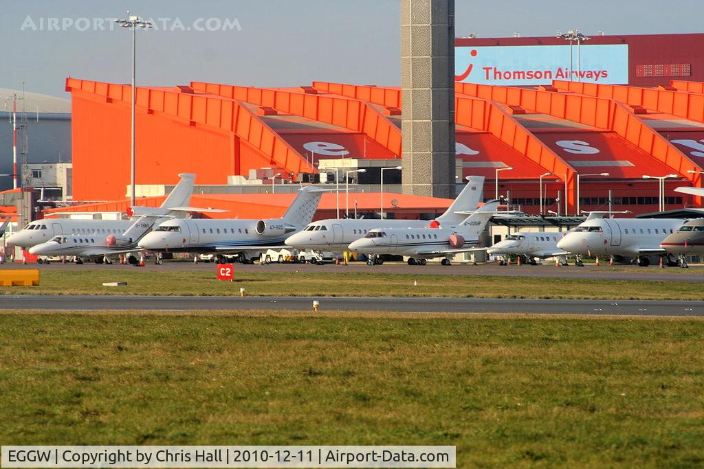London Luton Airport, London, England United Kingdom (EGGW) - Bizjets at Luton Airport amongst which are: A7-RZC Bombardier CL600, G-ODUR Hawker 800XP and G-THNX Cessna C525 Citation
