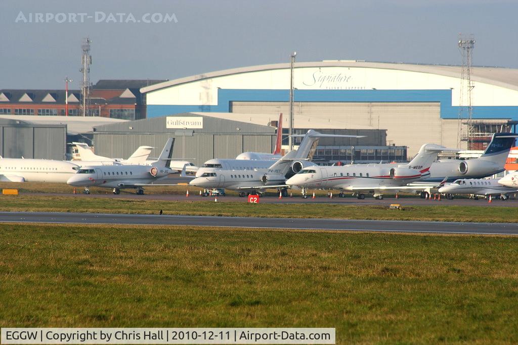 London Luton Airport, London, England United Kingdom (EGGW) - Bizjets at Luton Airport amongst which are: Hawker 900XP P4-PET, Bombardier CL300 G-MEGP, Gulfstream 5 VQ-BLA and Gulfstream 200 HB-JKE