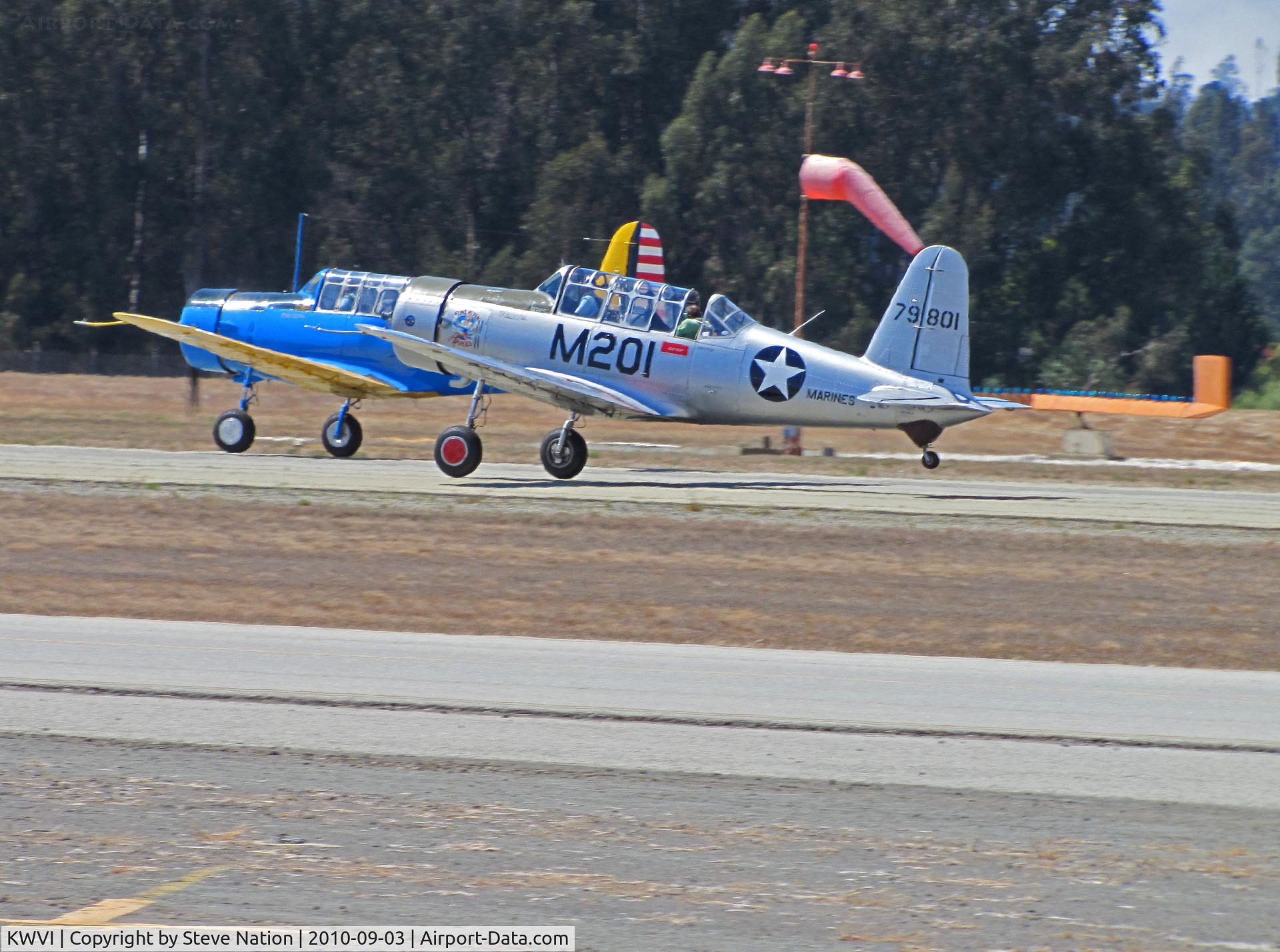Watsonville Municipal Airport (WVI) - BT-13 N71502 silver Marines M-201 and N65364 USAAC colors lift off @ 2010 Watsonville fly-in