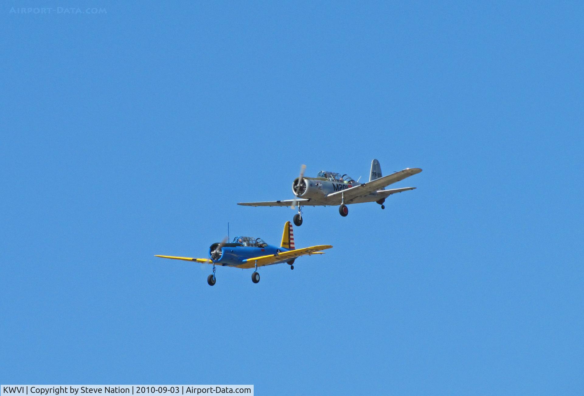 Watsonville Municipal Airport (WVI) - BT-13 N71502 silver Marines M-201 and N65364 USAAC colors on final approach @ 2010 Watsonville fly-in