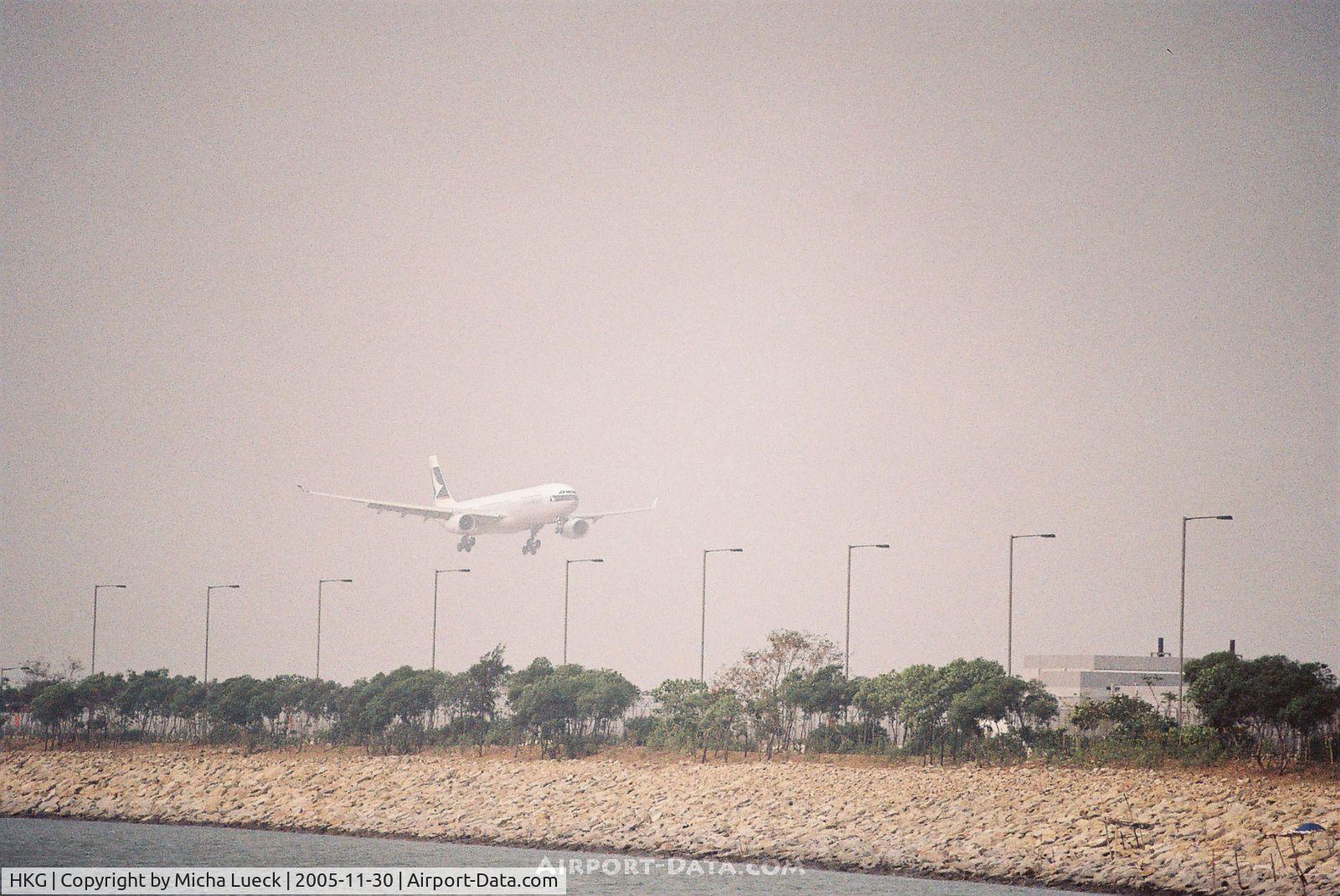 Hong Kong International Airport, Hong Kong Hong Kong (HKG) - The smog adds to a dramatic effect when aircraft appear out of the haze at Hong Kong's Chep Lap Kok airport (A330 of Cathay Pacific Airways)