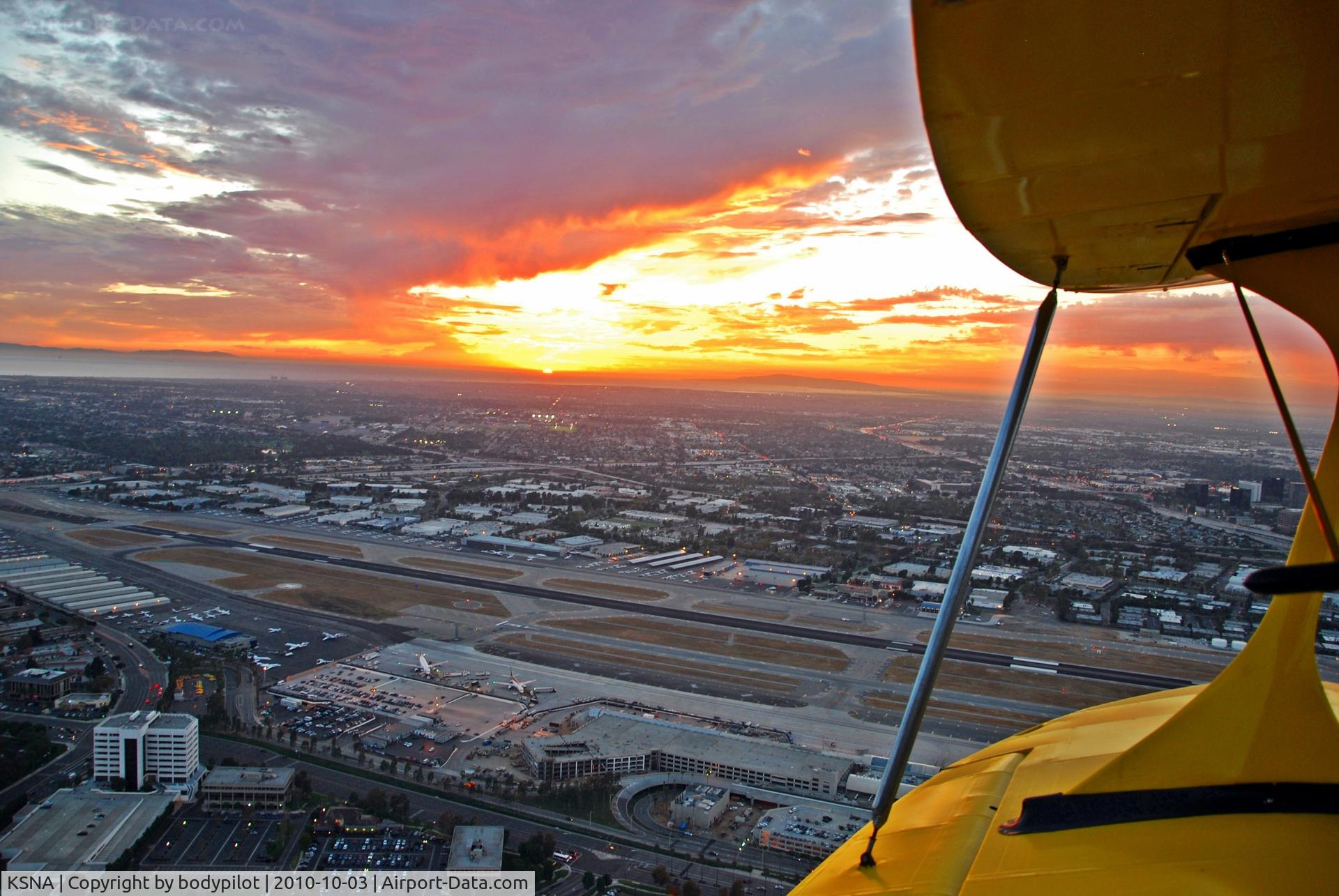 John Wayne Airport-orange County Airport (SNA) - Awesome sunset between Palos Verdes and Catalina Island, John Wayne airport (KSNA) and an open cockpit biplane - perfect view!