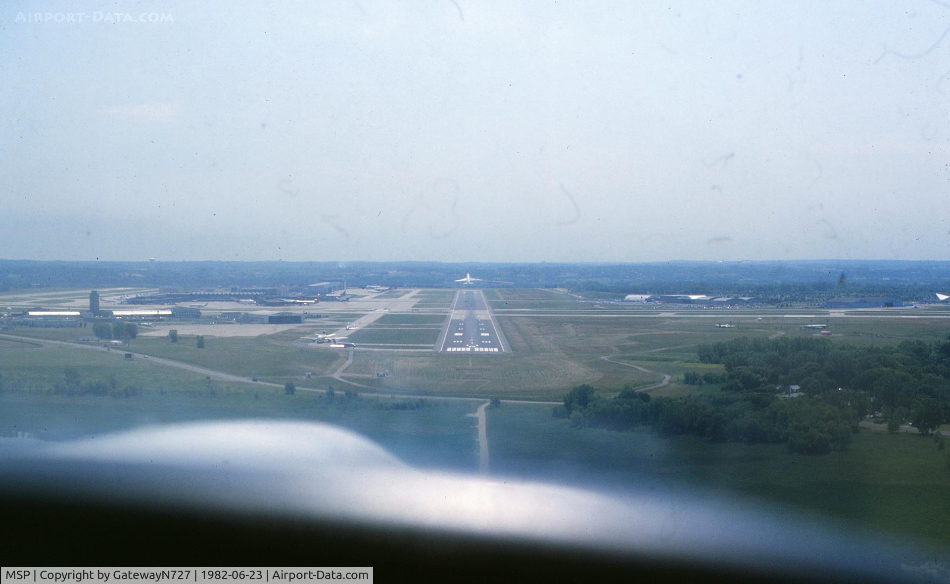 Minneapolis-st Paul Intl/wold-chamberlain Airport (MSP) - Inside of a mile final for rwy 11R. A NW 747 is seen climbing off the departure end of the runway. Photo taken from Piper Arrow N3831M.