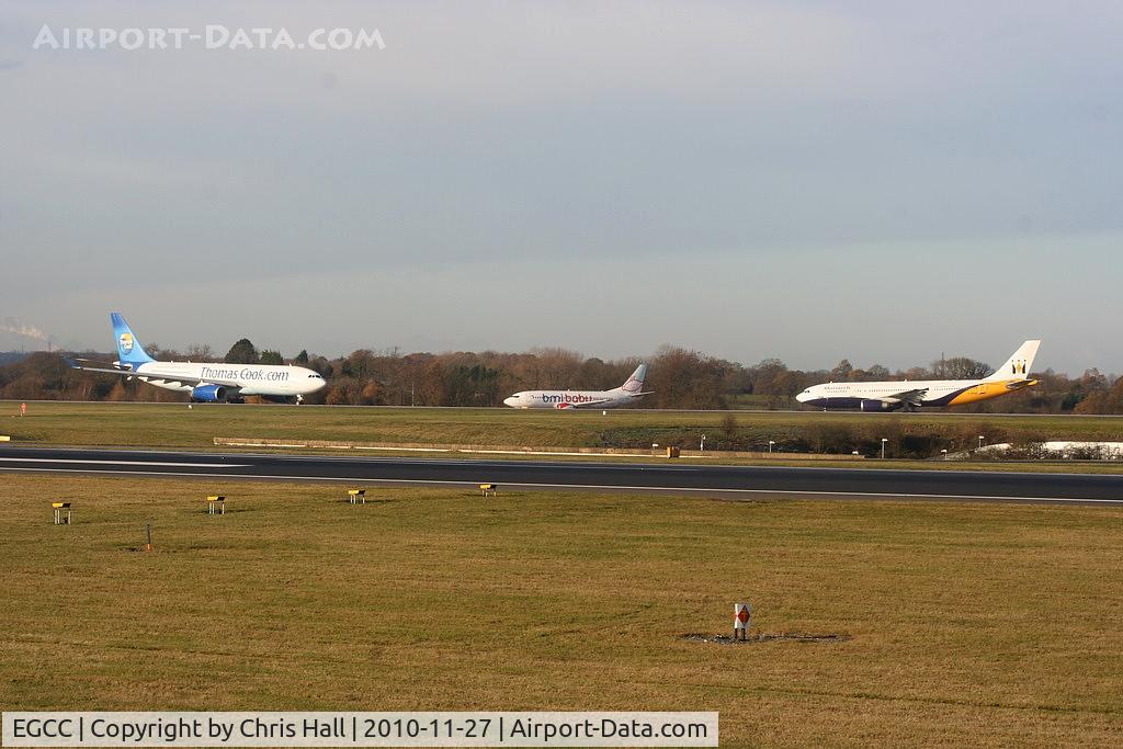 Manchester Airport, Manchester, England United Kingdom (EGCC) - Thomas Cook A330 lined up ready for departure as BMI Baby B737 and Monarch B767 hold