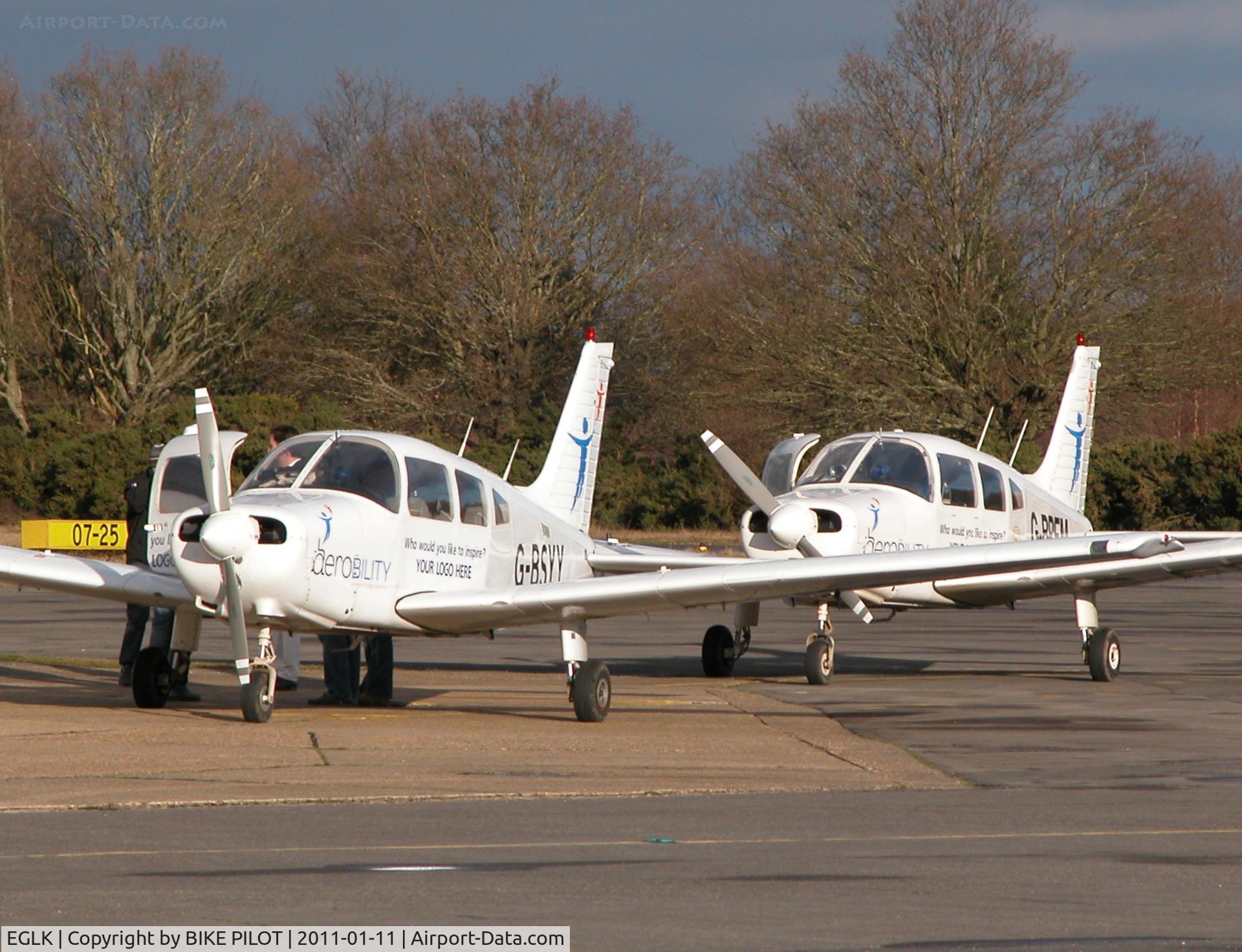 Blackbushe Airport, Camberley, England United Kingdom (EGLK) - Both Aerobility's Cherokee Warrior II's at the pumps