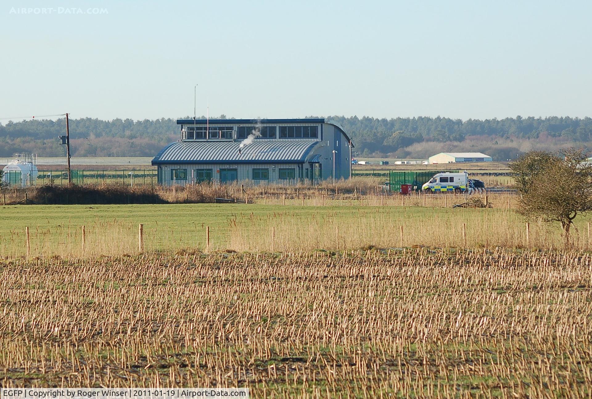 Pembrey Airport, Pembrey, Wales United Kingdom (EGFP) - Hangar used by the Dyfed-Powys Police Air Support Unit helicopter (G-DPPF). Situated on the former RAF Station Pembrey technical site.