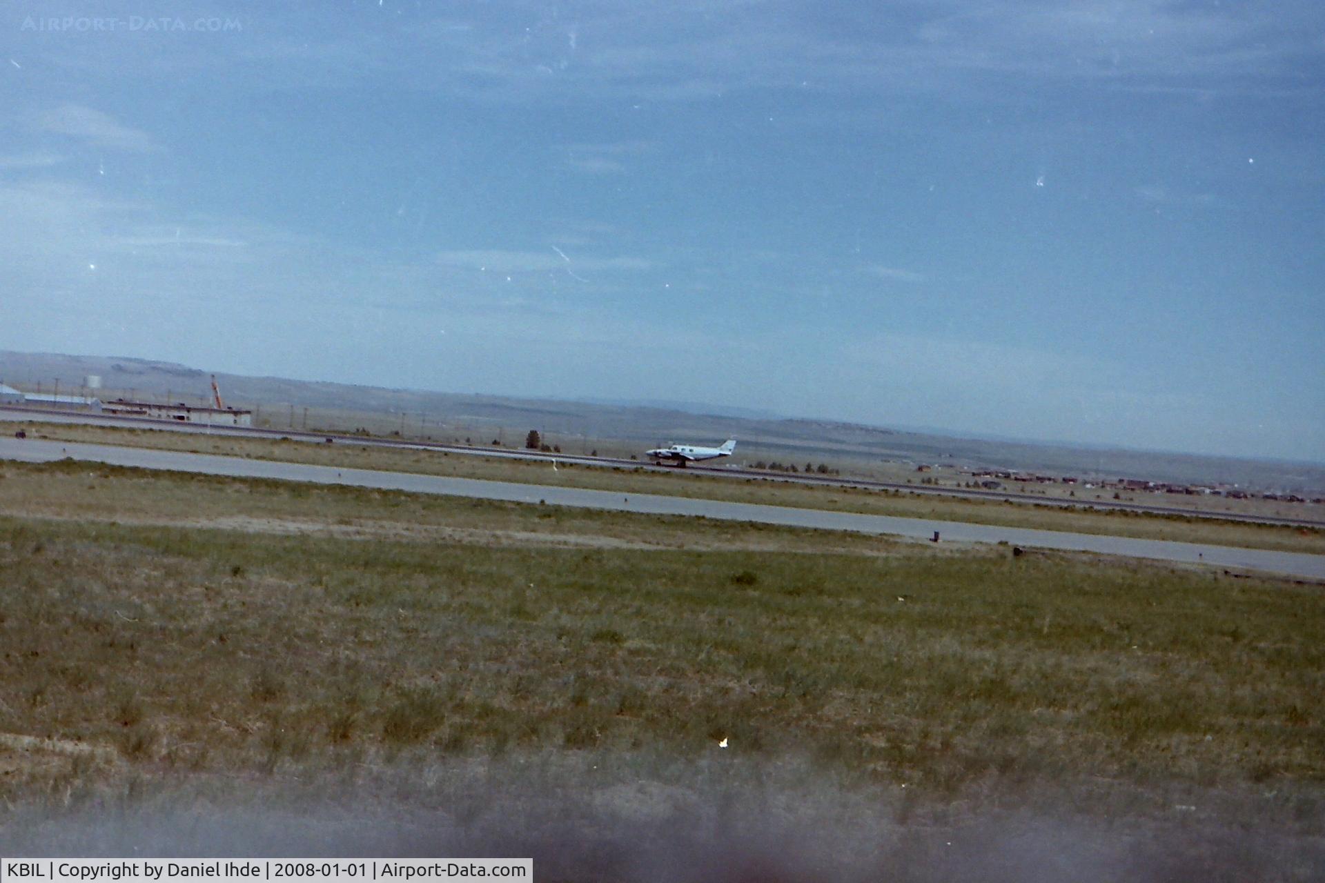 Billings Logan International Airport (BIL) - Twin Piper rolling down Billings Logan runway 27R in June of 1981