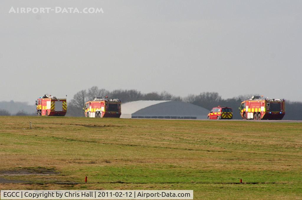 Manchester Airport, Manchester, England United Kingdom (EGCC) - Fire trucks racing down the runway after Thomas Cook B767 G-DAJC, which made an emergency landing with a problem with its flaps
