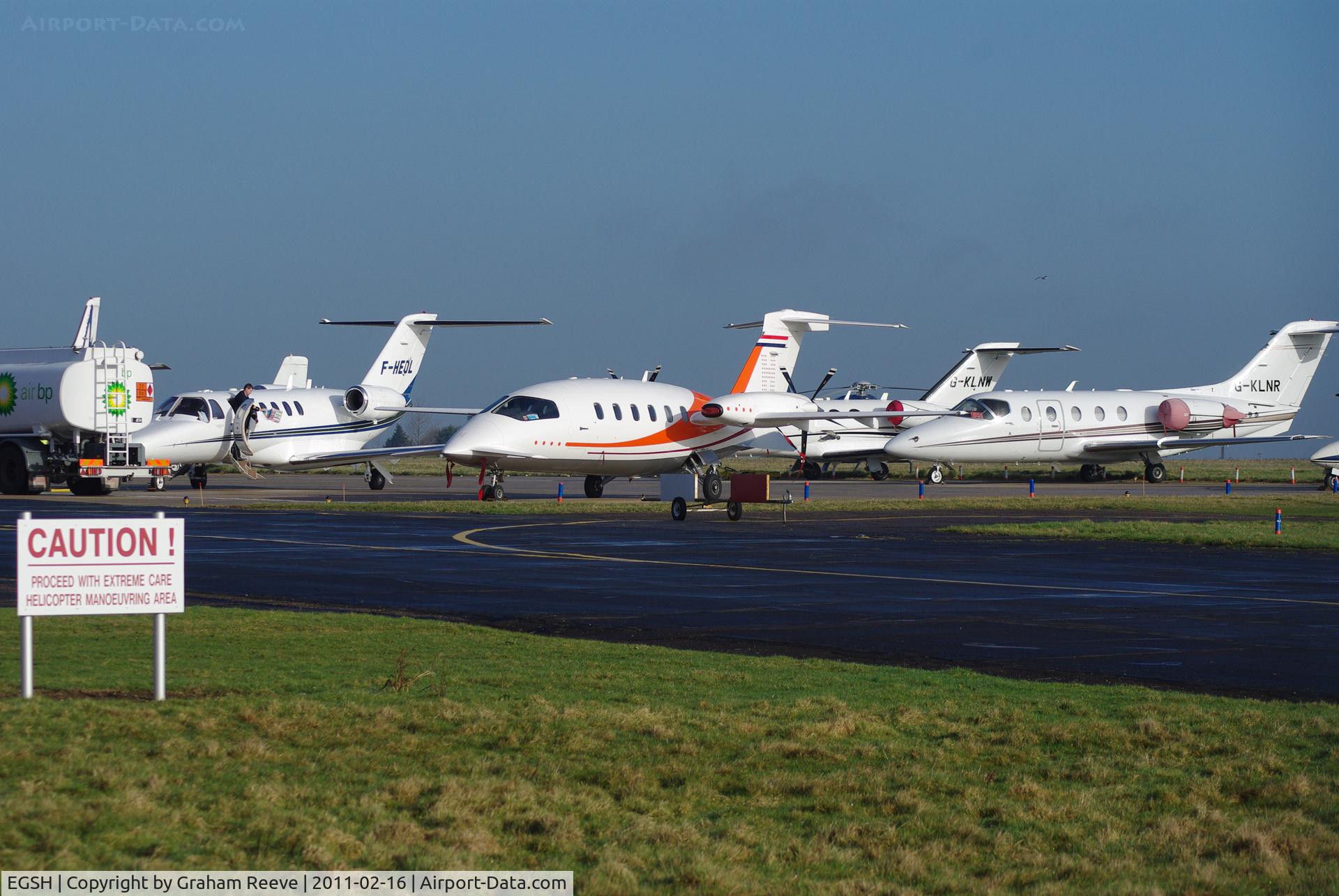 Norwich International Airport, Norwich, England United Kingdom (EGSH) - Busy aircraft park at Norwich.