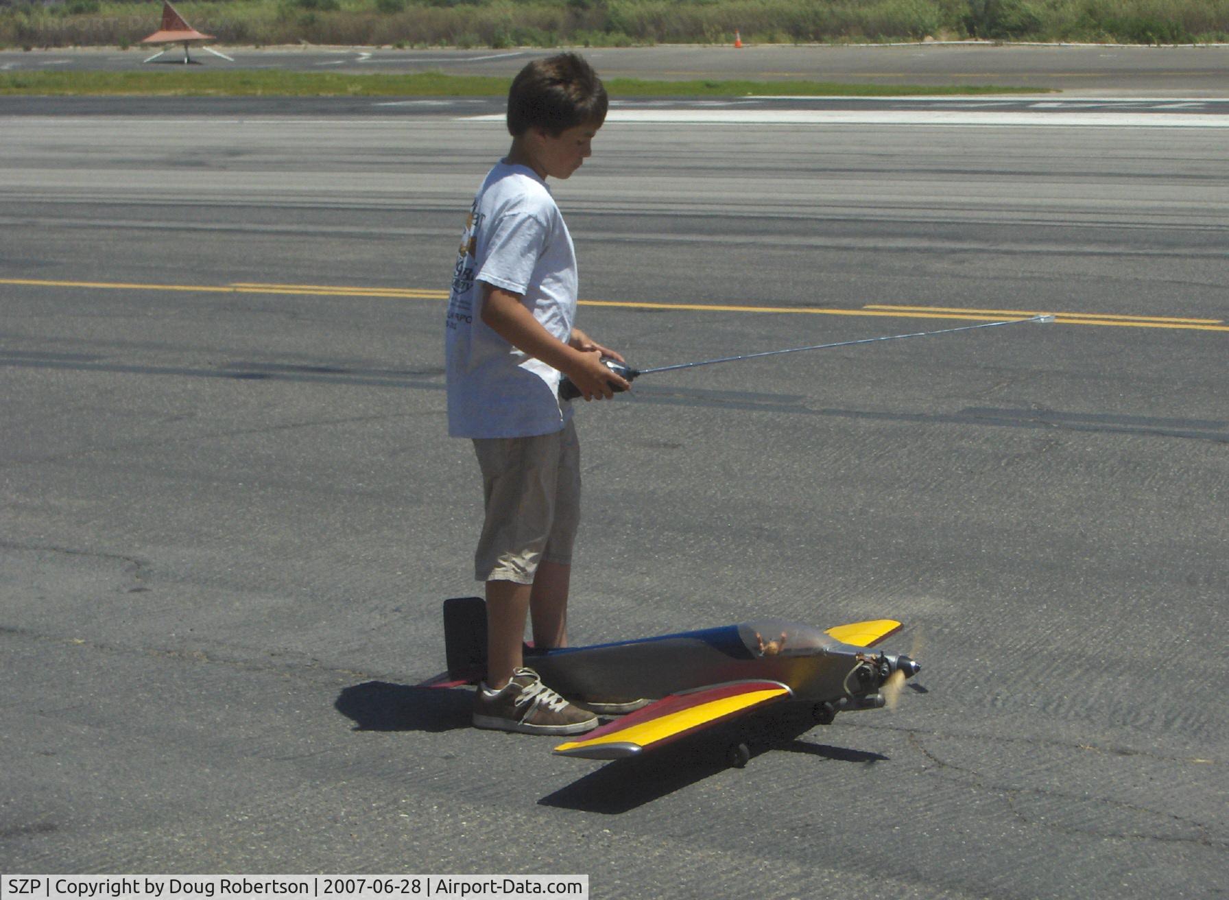 Santa Paula Airport (SZP) - High power runup using the ankle-chock holdback technique. Yes, that's Sammy Mason, in 2007 about 13 years old.