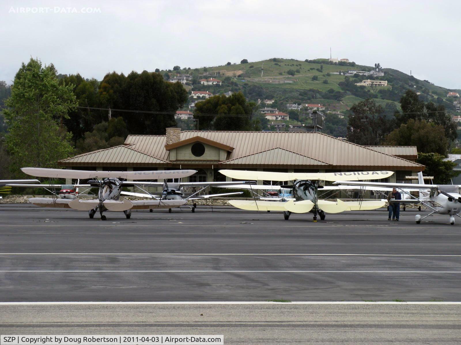 Santa Paula Airport (SZP) - A pair of WACO Classic YMF-F5Cs parked on the transient line on First Sunday Aviation Museum of Santa Paula Open House Fly-In. N196RB & N110AS.