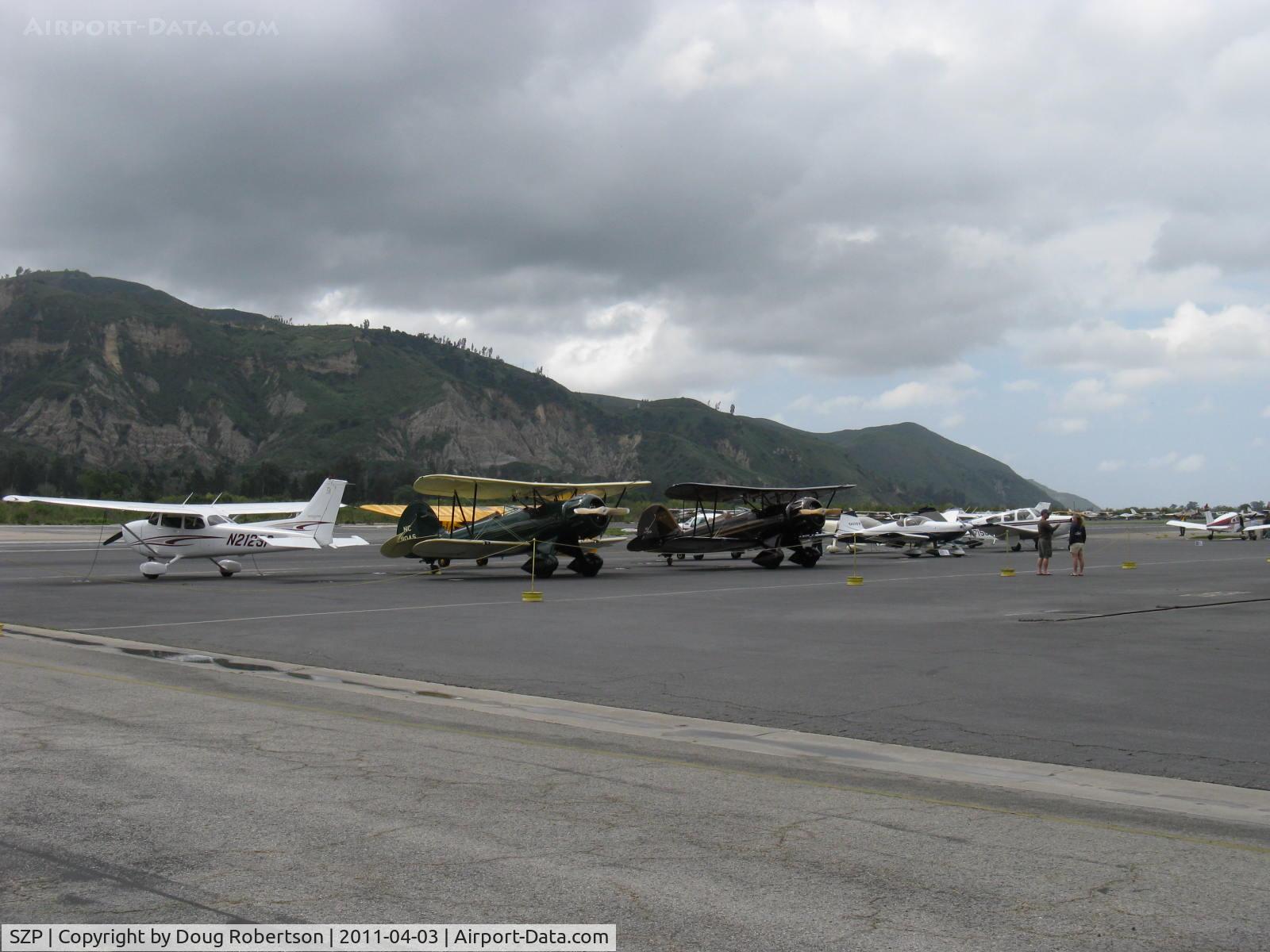 Santa Paula Airport (SZP) - A pair of WACO Classic YMF-F5Cs on the transient line on First Sunday Aviation Museum of Santa Paula Open House & Fly-In. N110AS & N196RB.