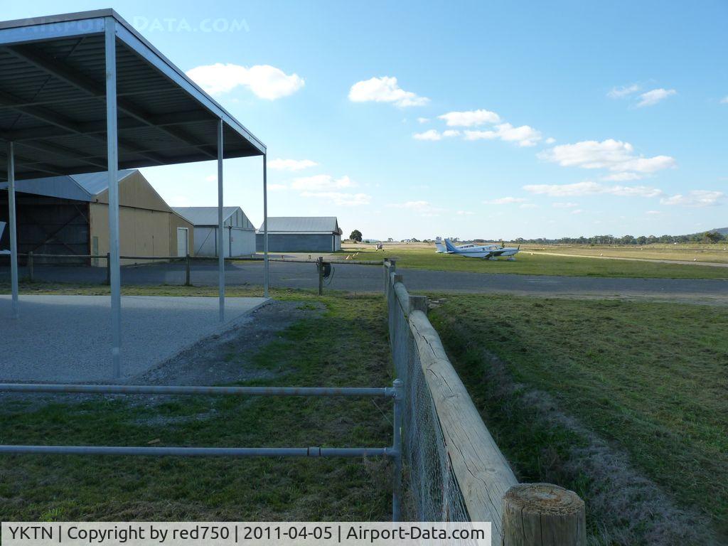 Kyneton Airport, Kyneton, Victoria Australia (YKTN) - Kyneton Aero Club Hangars and parking area looking north. The sealed strip can just be seen to the right.