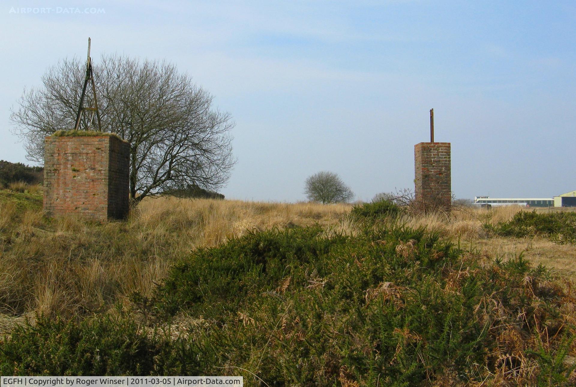 Swansea Airport, Swansea, Wales United Kingdom (EGFH) - Plinths for former WWII runway approach lighting equipment near the threshold to Runway 28.