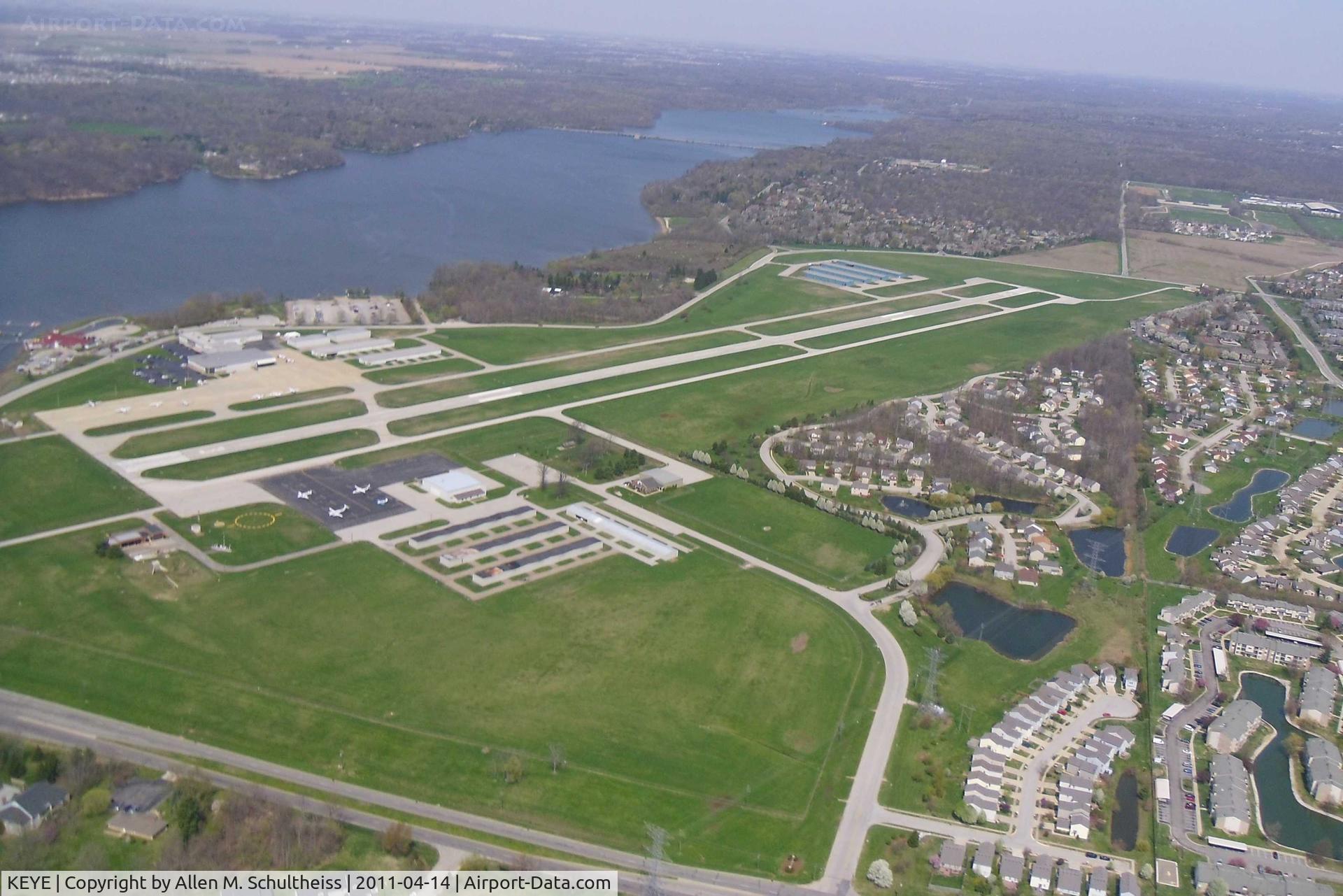 Eagle Creek Airpark Airport (EYE) - Looking North.  Rick's Boatyard Cafe is the Red Roof Structure to the left of the photo.