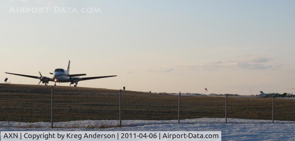 Chandler Field Airport (AXN) - Bemidji Aviation Beech Queen Air taxiing for its evening departure to MSP.
