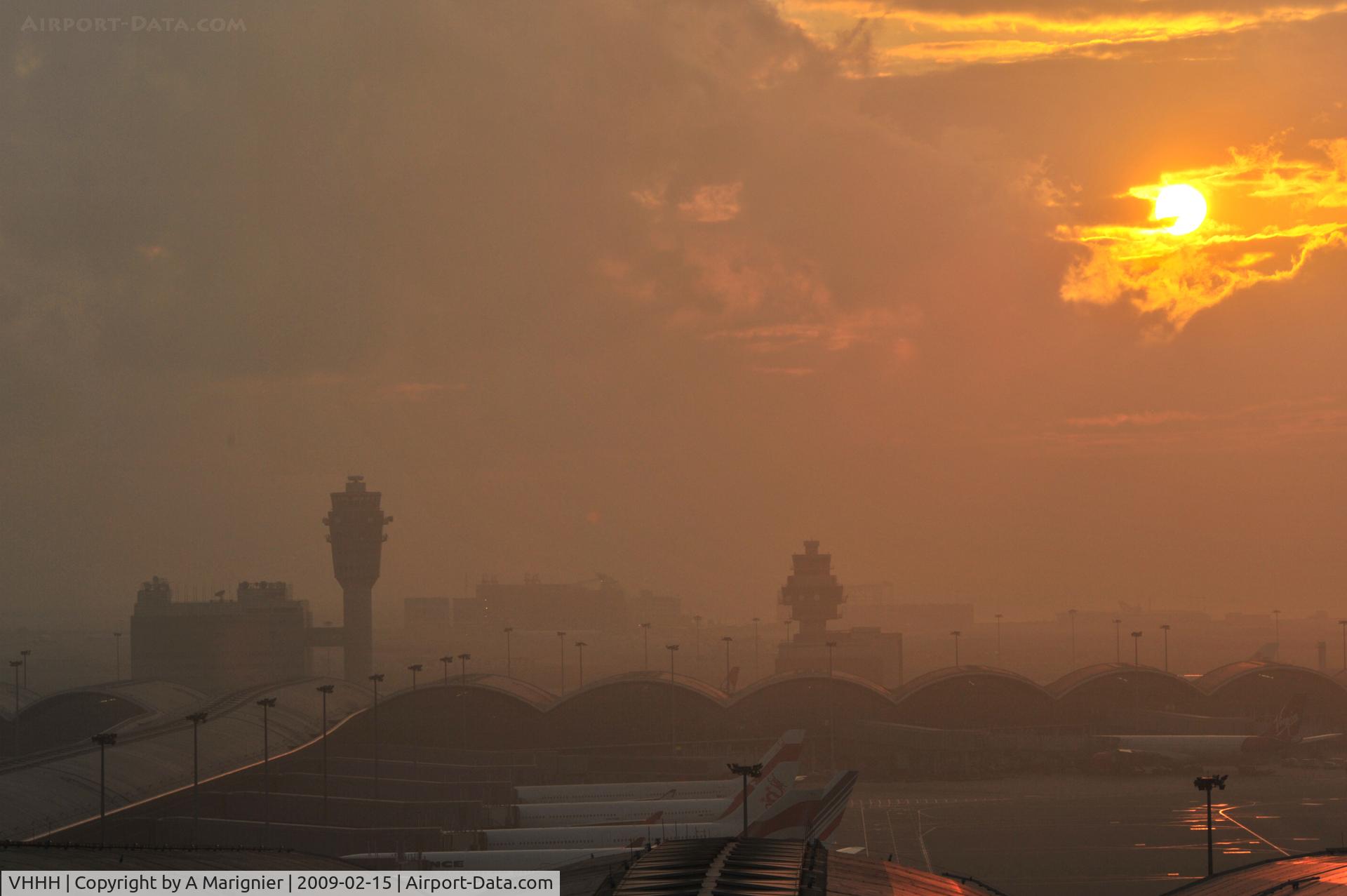 Hong Kong International Airport, Hong Kong Hong Kong (VHHH) - Hazy sunset as often in HK - luckily landings were on the opposite direction that day...