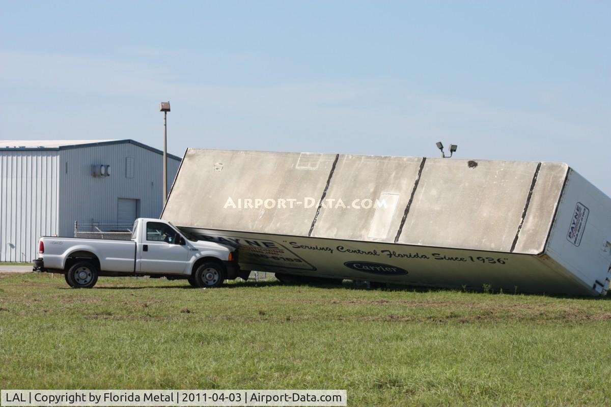 Lakeland Linder Regional Airport (LAL) - Storm damage from the 3/30/11 microburst/tornado.  Trailer blown down onto a Ford F250