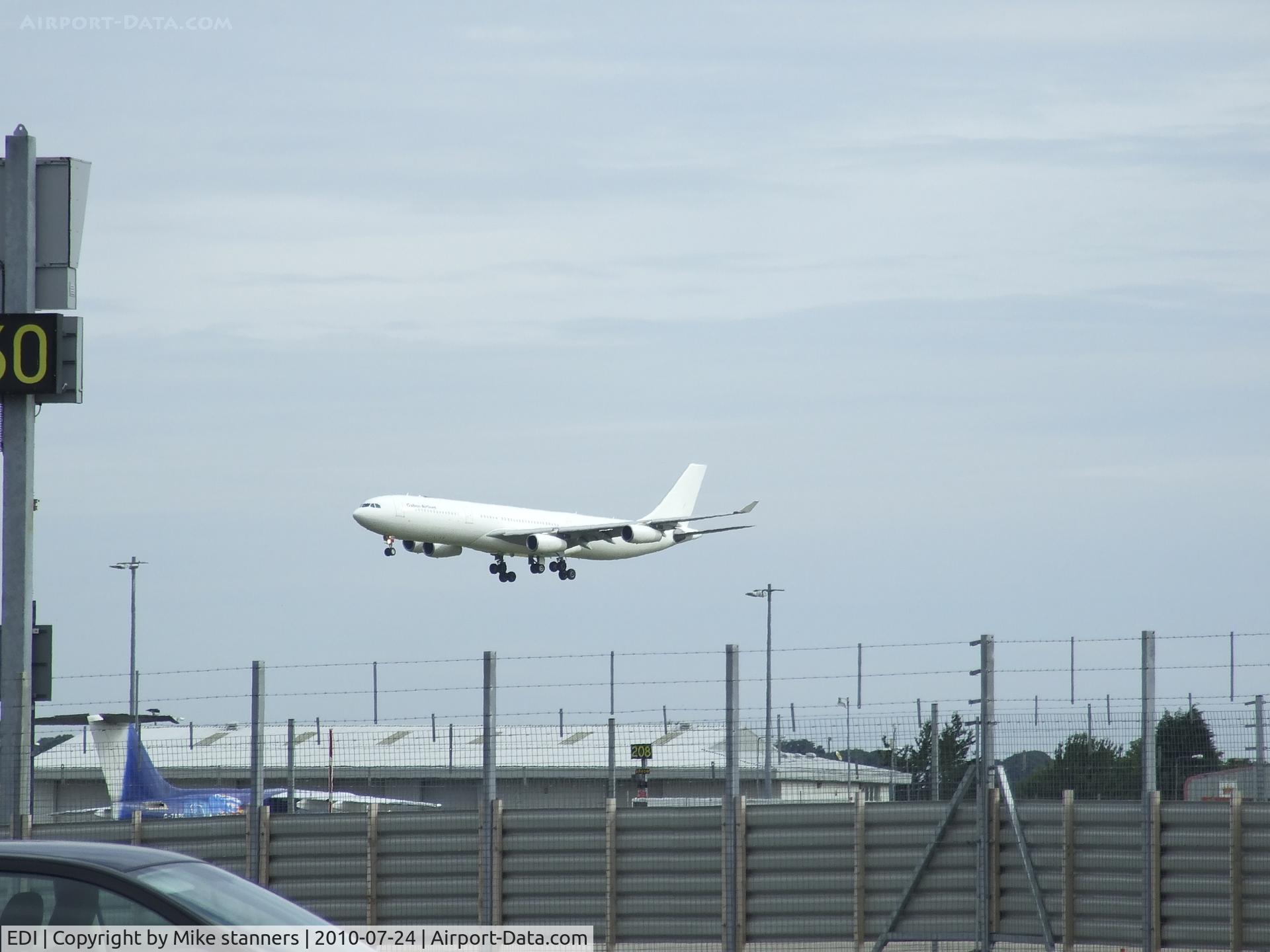 Edinburgh Airport, Edinburgh, Scotland United Kingdom (EDI) - hifly A340-313X CS-TMQ Landing on runway 24 on flight HFY660P ,Seen here from the long stay car park at EDI