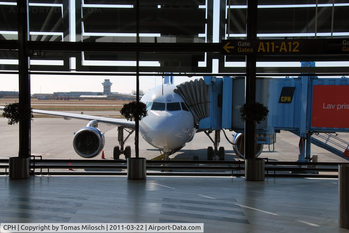 Copenhagen Airport, Kastrup near Copenhagen Denmark (CPH) - Finnair's Airbus OH-LVA at gate 14, in the background the tower of Copenhagen Airport