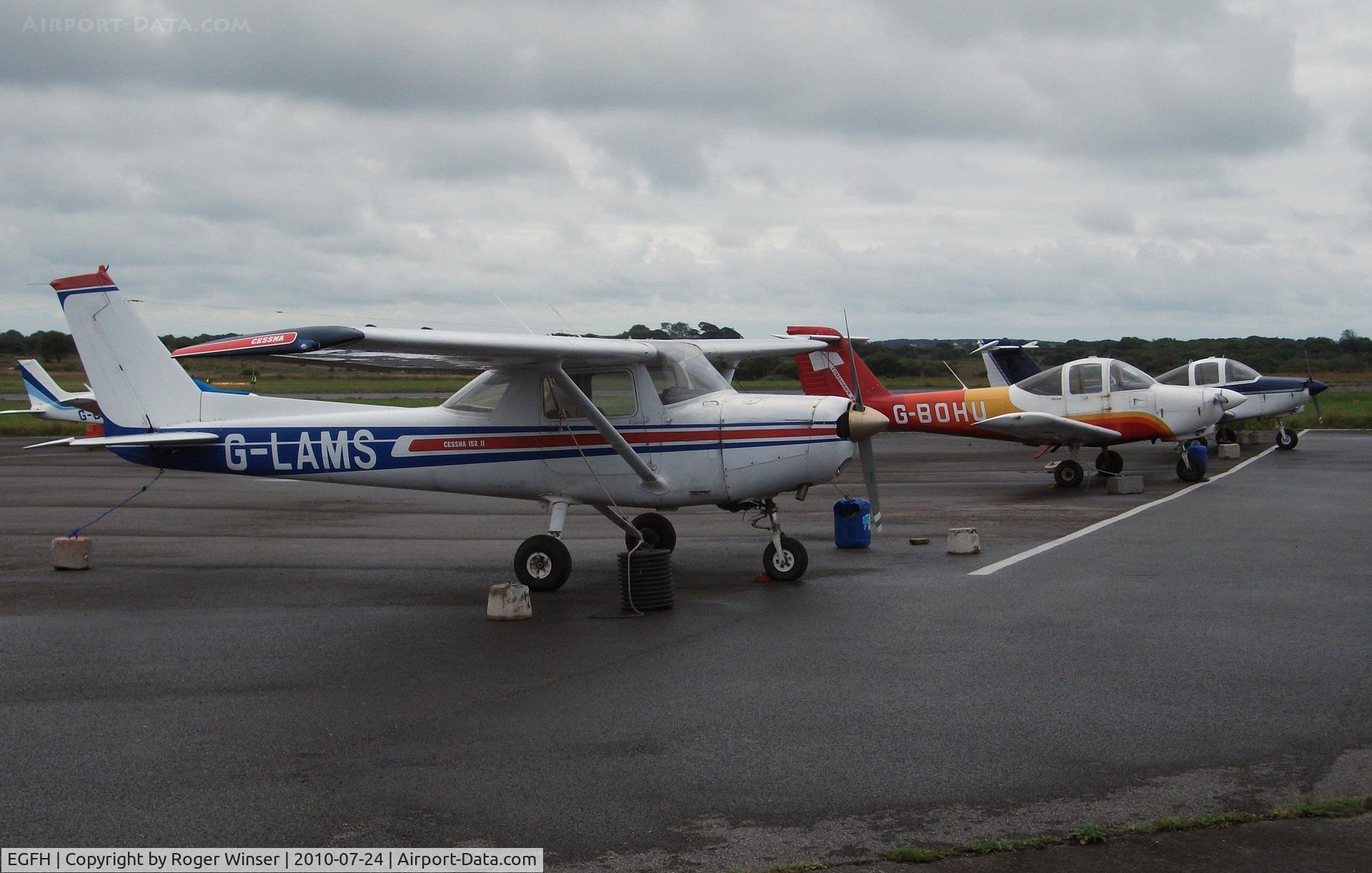 Swansea Airport, Swansea, Wales United Kingdom (EGFH) - Line up of Cambrian Flying School and Club's aircraft.